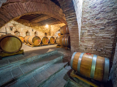 Montepulciano, Italy - April 23, 2019: Oak barrels in an old Italian underground wine cellar.のeditorial素材