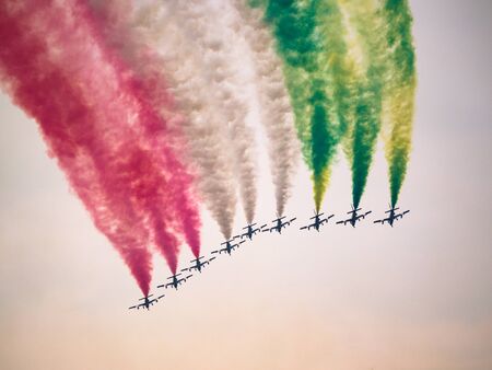 Aerobatic airshow with italian flag colors.