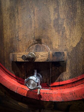 Detail of the tap of an oak barrel in which the "Brunello di Montalcino" wine is produced.の写真素材