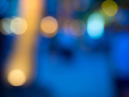 Background formed by blurred reflections of colored lights.