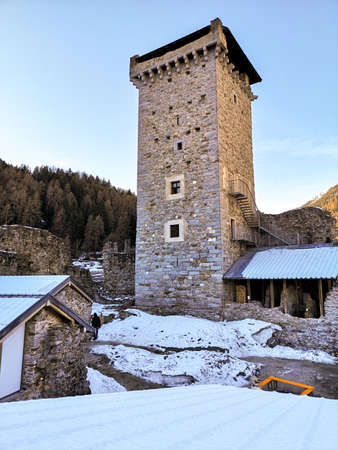 Winter view of the tower of the castle of San Michele which rises in the village of Ossana, in the Val di Sole, Trentino-Alto Adige, Italy.のeditorial素材