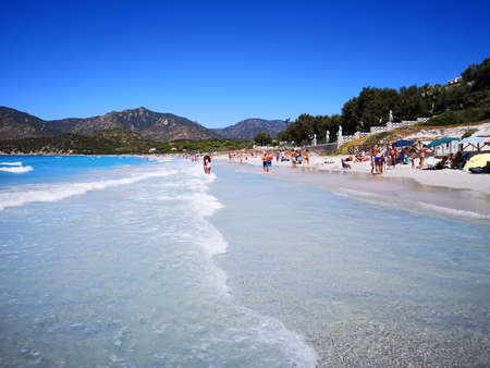 Villasimius, Italy - August 14, 2019: Blue and transparent water and the light sand of a beach in Sardinia.のeditorial素材