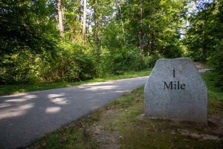 One half mile granite marker on the greenway walking trail in Mount Airy, NC