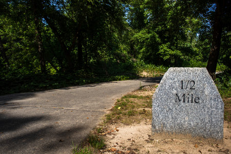 One half mile granite marker on the greenway walking trail in Mount Airy, NCの写真素材