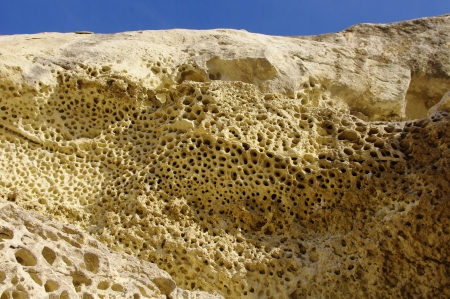 Weathered sandstone with holes near train station Nevsha, Bulgaria