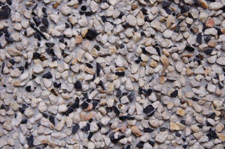Dark  mosaic on the wall outside house
