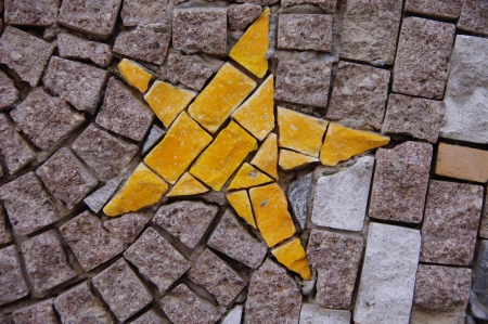 Art mosaic on the wall outside houseの写真素材