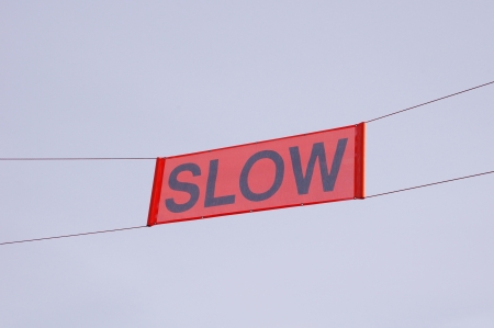 Sign Slow on ski slopeの写真素材