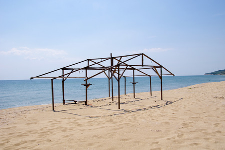 Wooden construction of hut on beach in sunny dayの写真素材