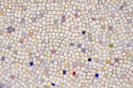 Mosaic of broken tile pieces on wall closeupの写真素材