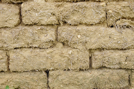 Old mud bricks wall closeup