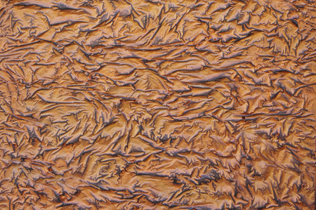 Decorative relief brown and black plaster closeupの写真素材