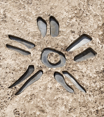 Metal sun of ceramic tile closeupの写真素材