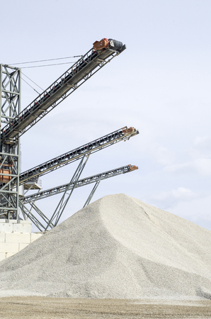 Several belt conveyors in Gravel Quarry  in cloudy dayの写真素材