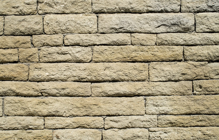 Old stone wall closeup  in sunny day