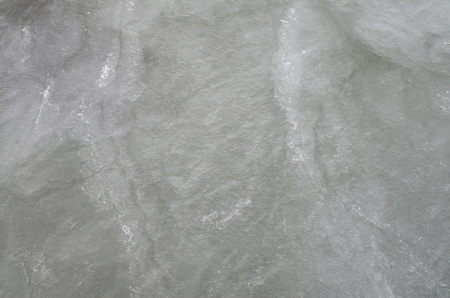Frozen water in lake closeup in cloudy dayの写真素材