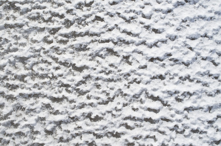 Snow and ice waves closeup  in sunny dayの写真素材