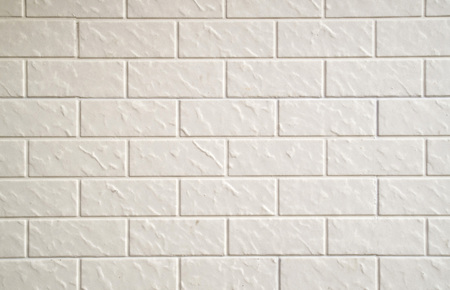 New decorative ecru plaster imitating cladding slabs closeup
