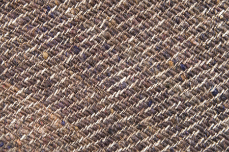 Old woolen brown handmade rug closeup