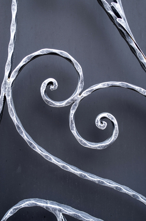 Grey curved wrought ironwork closeup
の写真素材