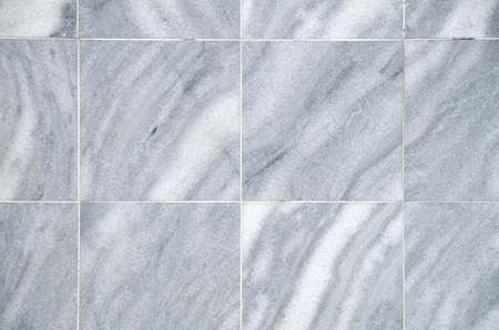 New gray and white decorative marble tiles on wall closeupの写真素材