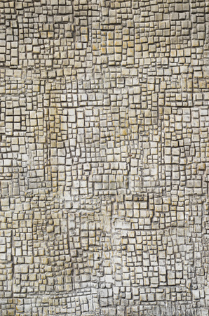 Old ecru plaster on wall closeup in sunny day
の写真素材