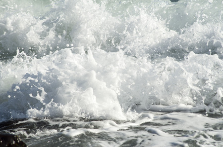 Foam and drops of breaking sea waves in sunny day, Black Sea