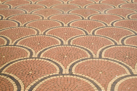 Small colorful pavers in citcles on square closeup