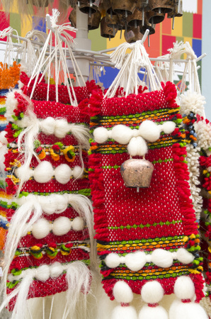 Colorful bulgarian woven souvenirs with a forged bell, Europeの写真素材