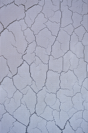 Cracked white paint on glass closeup
