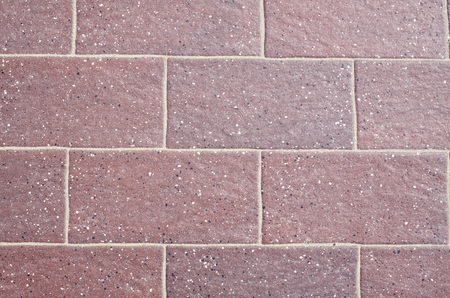 Wine-colored ceramic tiles on the floor closeupの写真素材