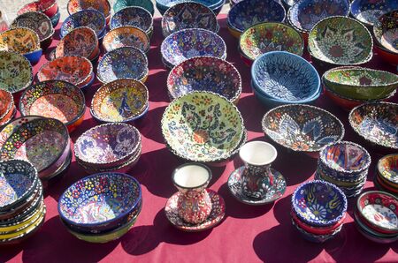 Colorful handmade painted bowls and plates wtih floral ornaments in Albania, Europe