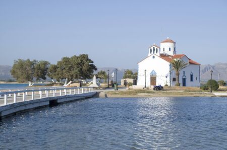 Small white traditional church  close to Elafonisos Port in Greece, Europe