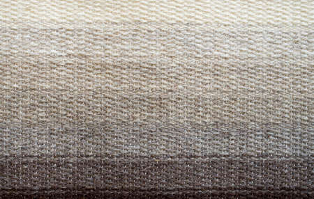 New rug in iridescent colors from ecru to brow closeup