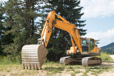 Crawler Excavators with digging bucket  in sunny day