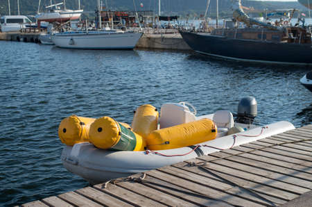 Boat loaded with regatta mark buoys for a yacht race on the pier in Varna, Bulgariaの写真素材