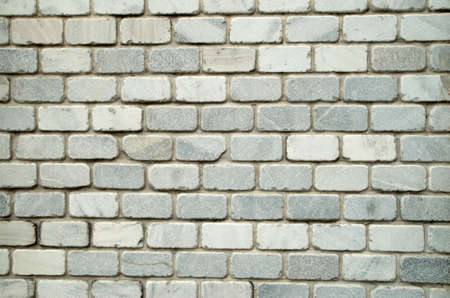 New light decorative marble bricks on wall closeup