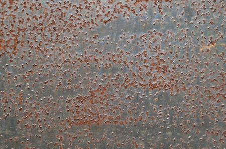Old rusty black metal surface close up