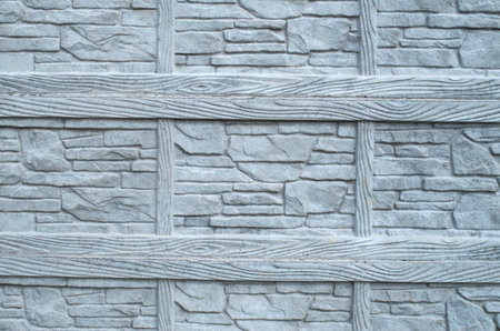 Gray concrete surface imitating wood and stone close up