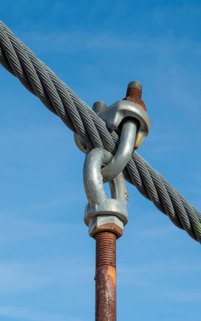 The fastening of steel wire ropes with safety locking U-Bolts made for a bridge across the river.