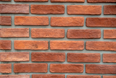 New decorative brick on gray background  on wall close upの写真素材