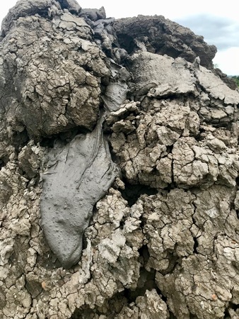 Crater of the recently erupted mud volcano at Piparo on the Caribbean island of Trinidad & Tobago displaying gray mud lavaの写真素材