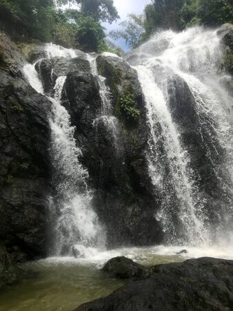 Lush greenery and cascading water near the beautiful Argyle Falls near Roxborough on the Caribbean...