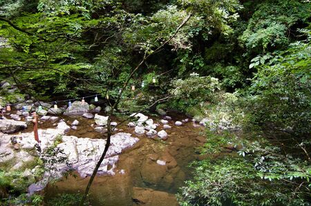 Akame 48 Waterfalls: Mysterious scenery with huge trees and huge moss covered rock formations, untouched nature, lush green vegetation, cascading waterfalls & natural pools in rural Japan near Osakaの写真素材
