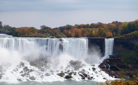 Beautiful and impressive panorama of the Niagara falls in Ontario (Canada) on a bright autumn dayの写真素材