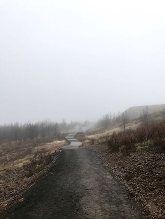 Colorful outdoor autumn scenery in the Geothermal area of Geyser on the cloudy afternoon in the mountains of Bl?sk?gabygg? on the Golden Circle (Reyjkavik)の写真素材