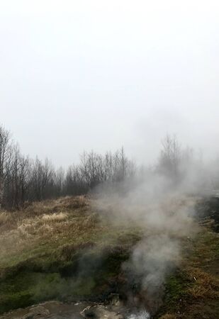 Colorful outdoor autumn scenery in the Geothermal area of Geyser on the cloudy afternoon in the mountains of Bl?sk?gabygg? on the Golden Circle (Reyjkavik)の写真素材