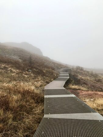 Colorful outdoor autumn scenery in the Geothermal area of Geyser on the cloudy afternoon in the mountains of Bl?sk?gabygg? on the Golden Circle (Reyjkavik)の写真素材