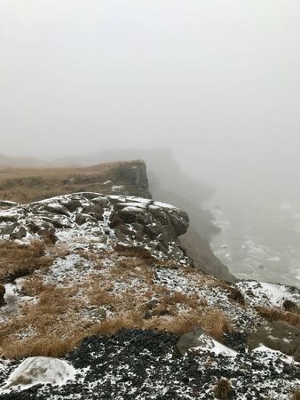 The majestic arctic Gullfoss waterfall landscape located in the canyon of the Hv?t? river on the Golden Circle Route in Iceland on a foggy autumn / winter day: Scenic cascades & cliffs with iceの写真素材