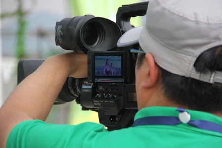 Cameraman shooting performance on the stage